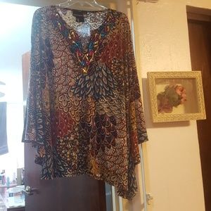 Poncho style asymmetrical hem top